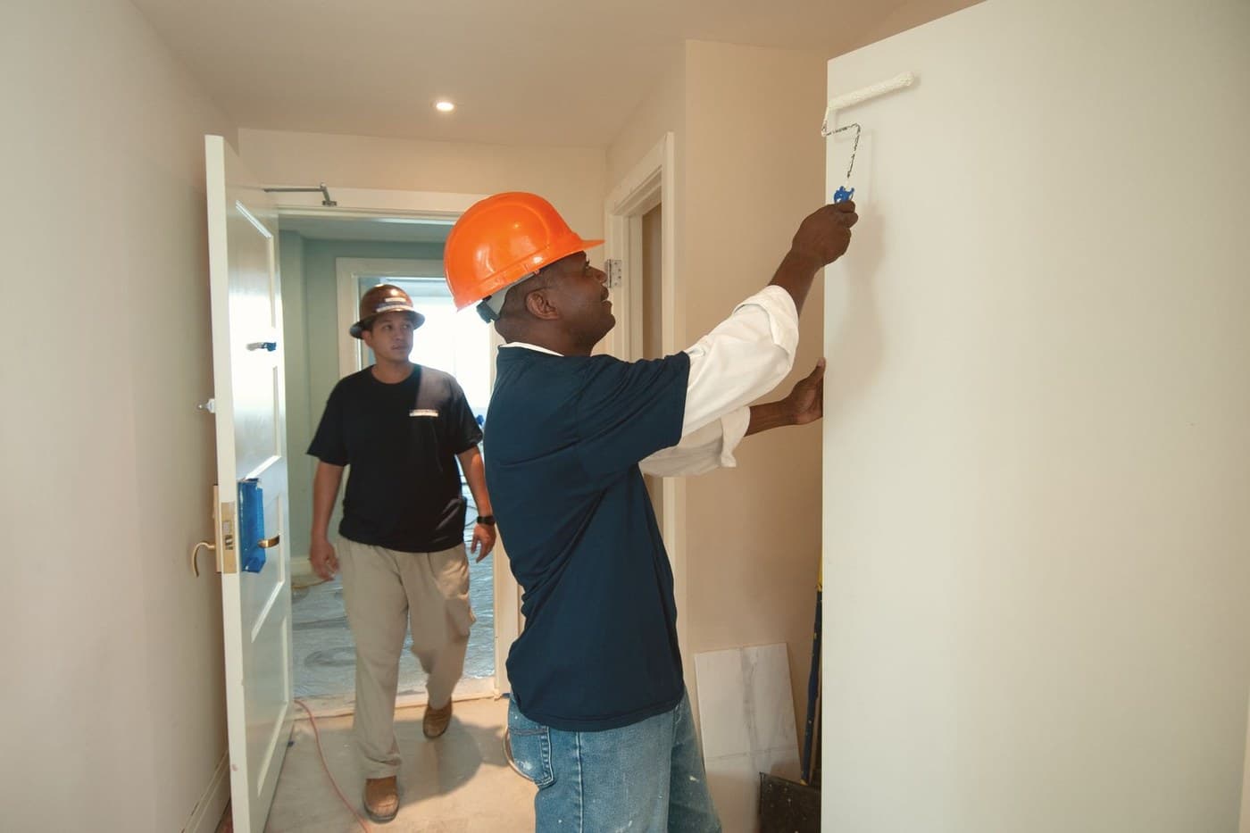 Crew repainting a hallway in a donated community project