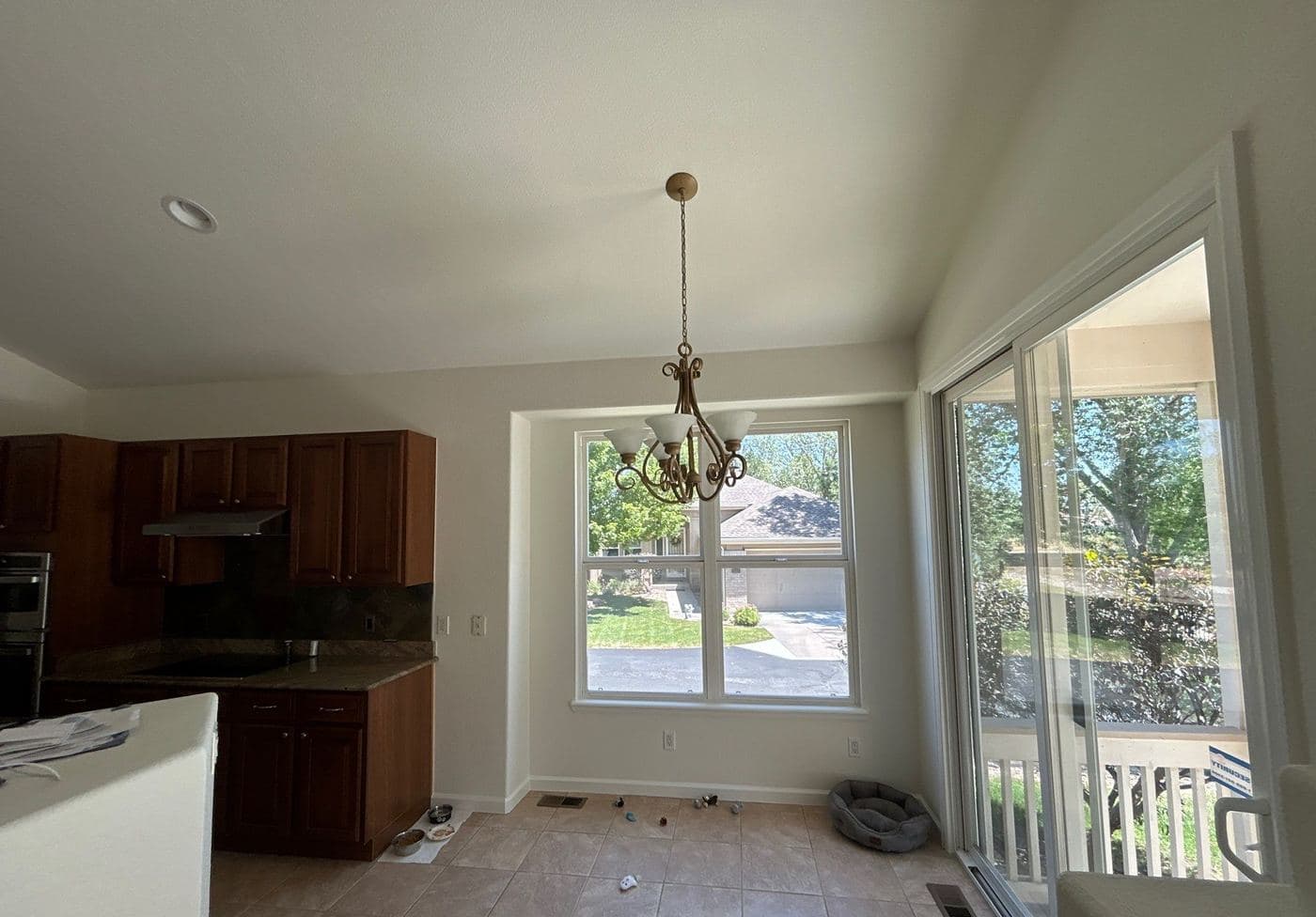 Smooth vaulted ceiling above a kitchen after popcorn texture removal