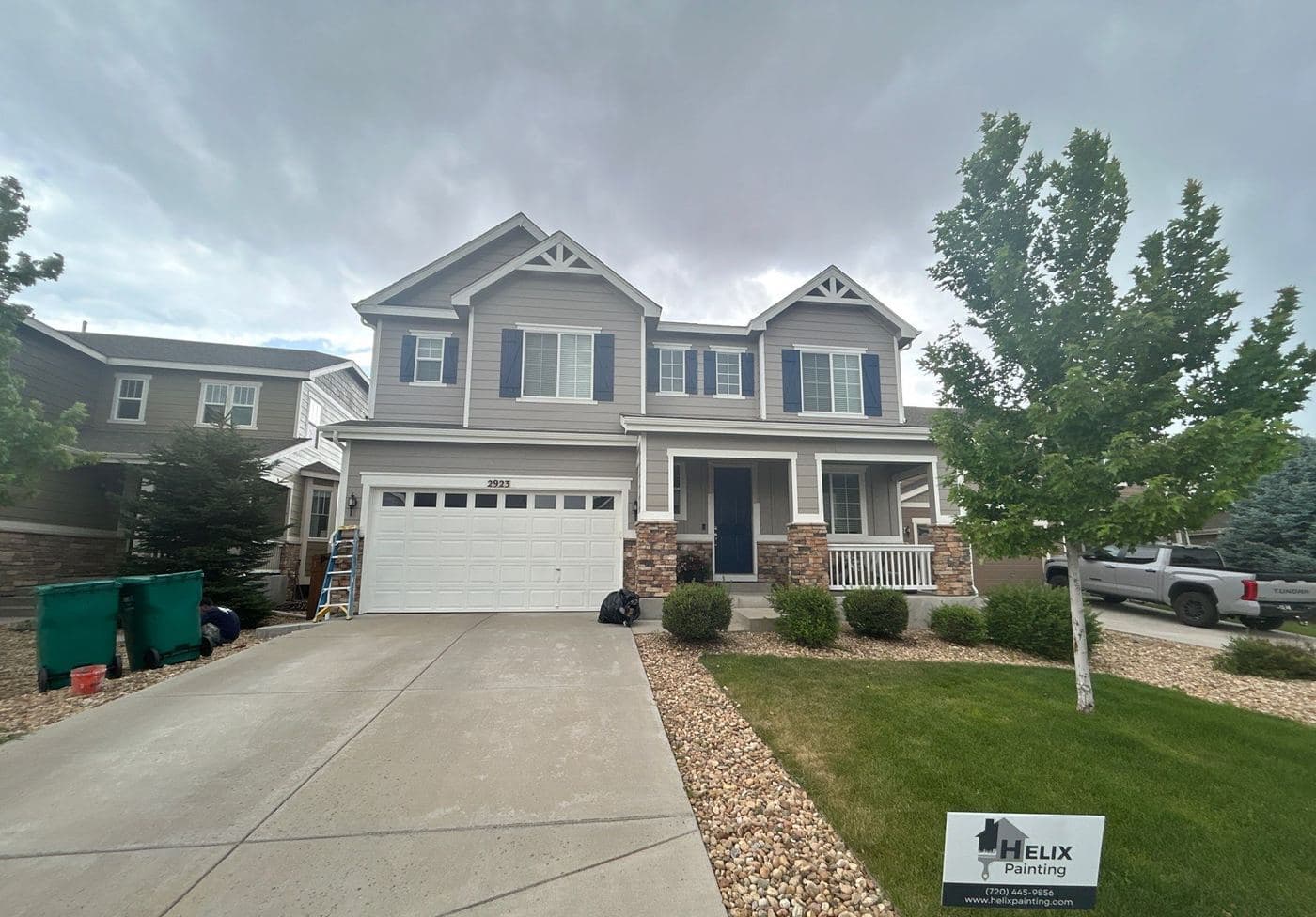 Gray home exterior repainted by Helix Painting