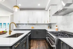 white kitchen cabinets on top and gray on bottom